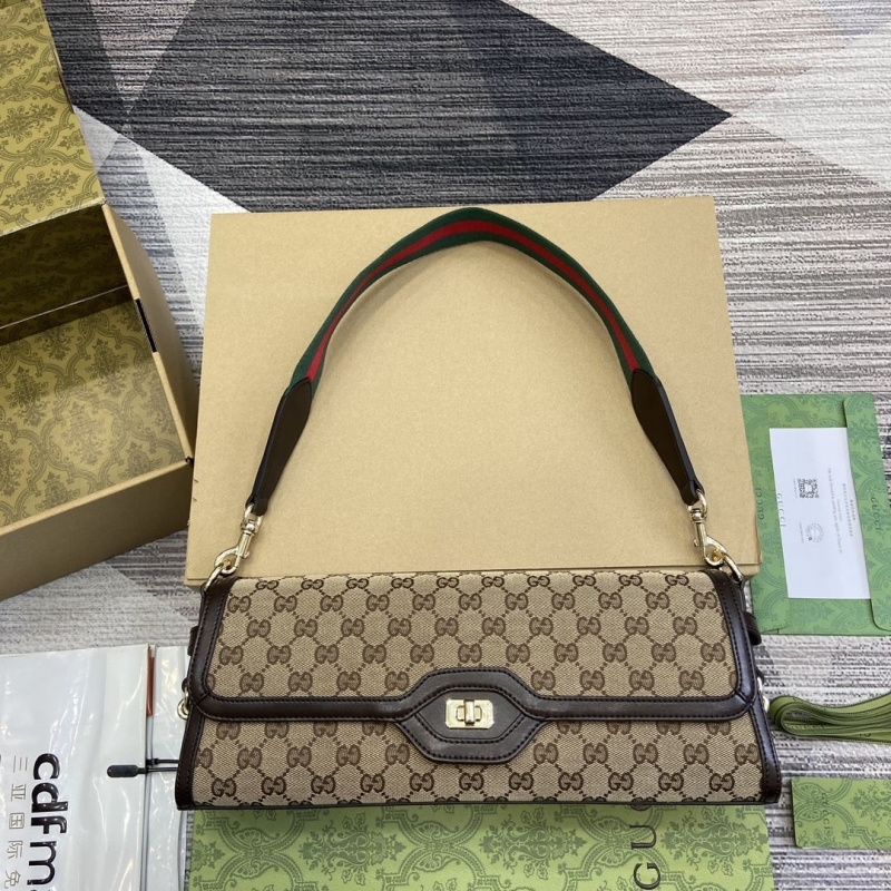 G*u*i top handle bags